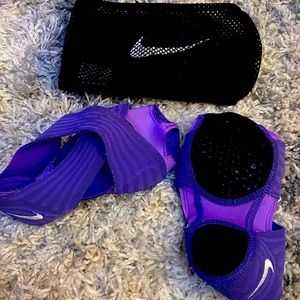 Barre Nike slippers. Comes with extra pair of grip toe sox